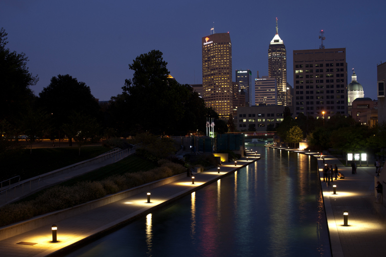 The Indianapolis skyline at night showing the numerous artificial lights being used.